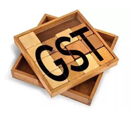 Image That Depicts The GST Concept - GST Text Written On Wooden Blocks.